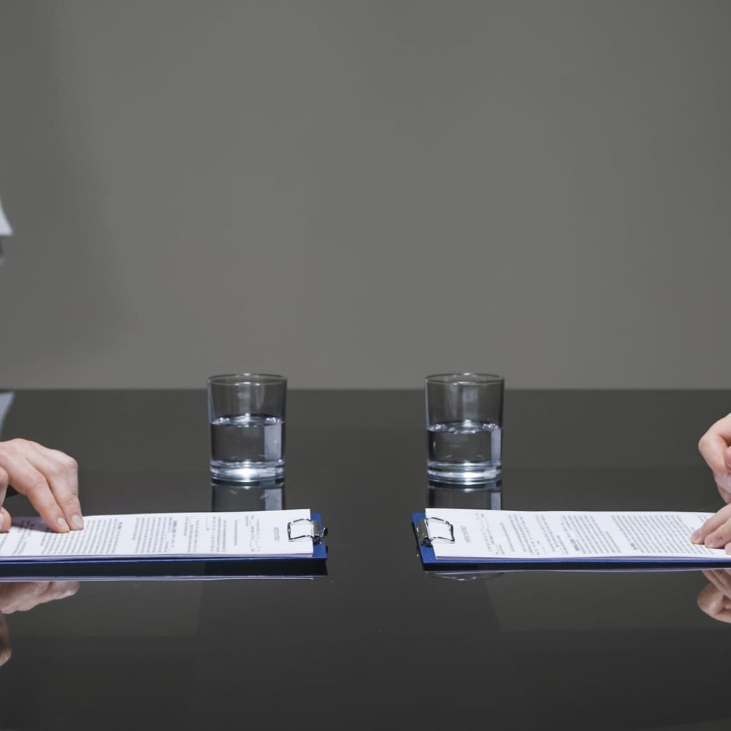 Businessmen signing contracts