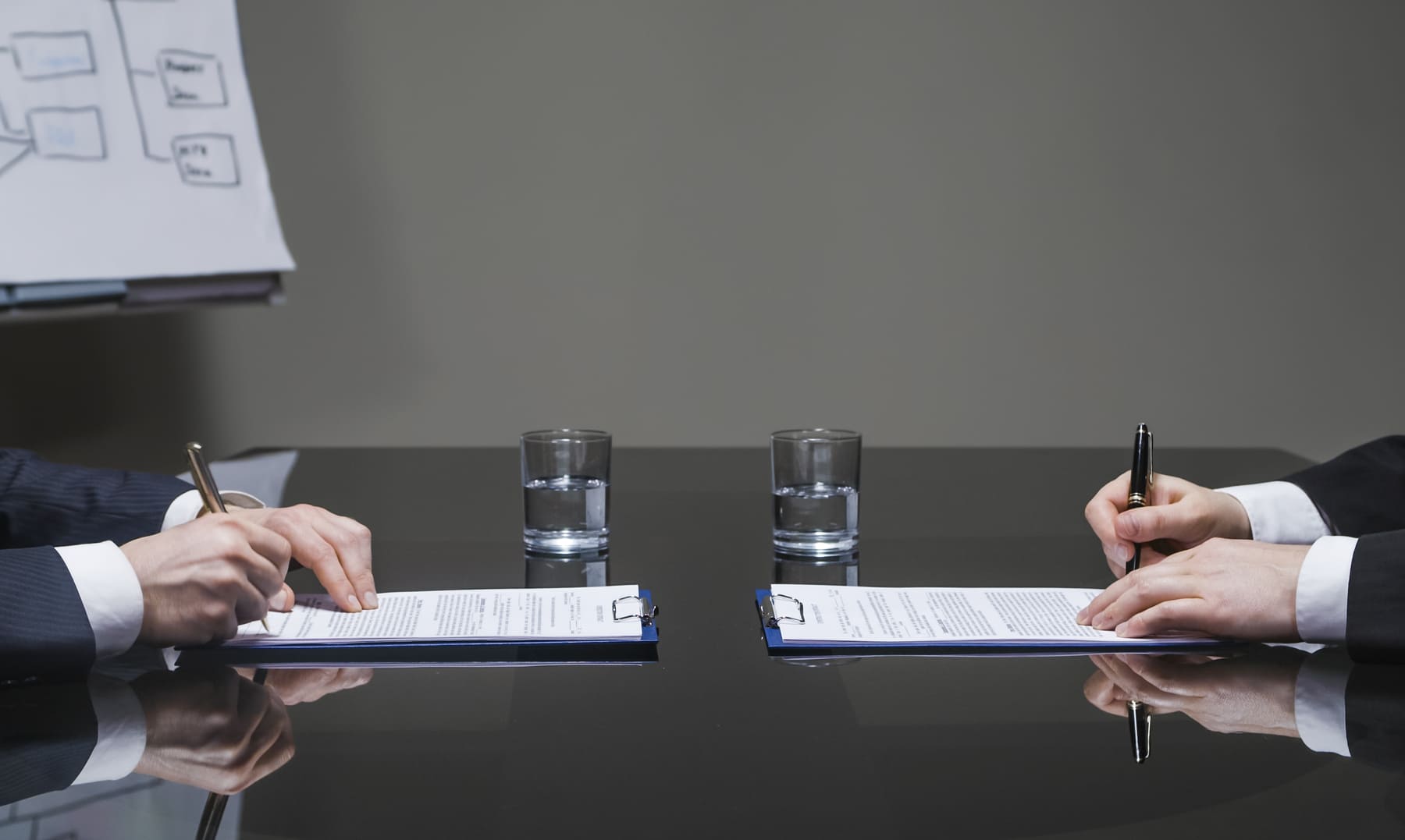 businessmen-signing-contracts