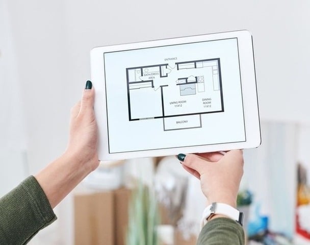 Hands holding digital tablet