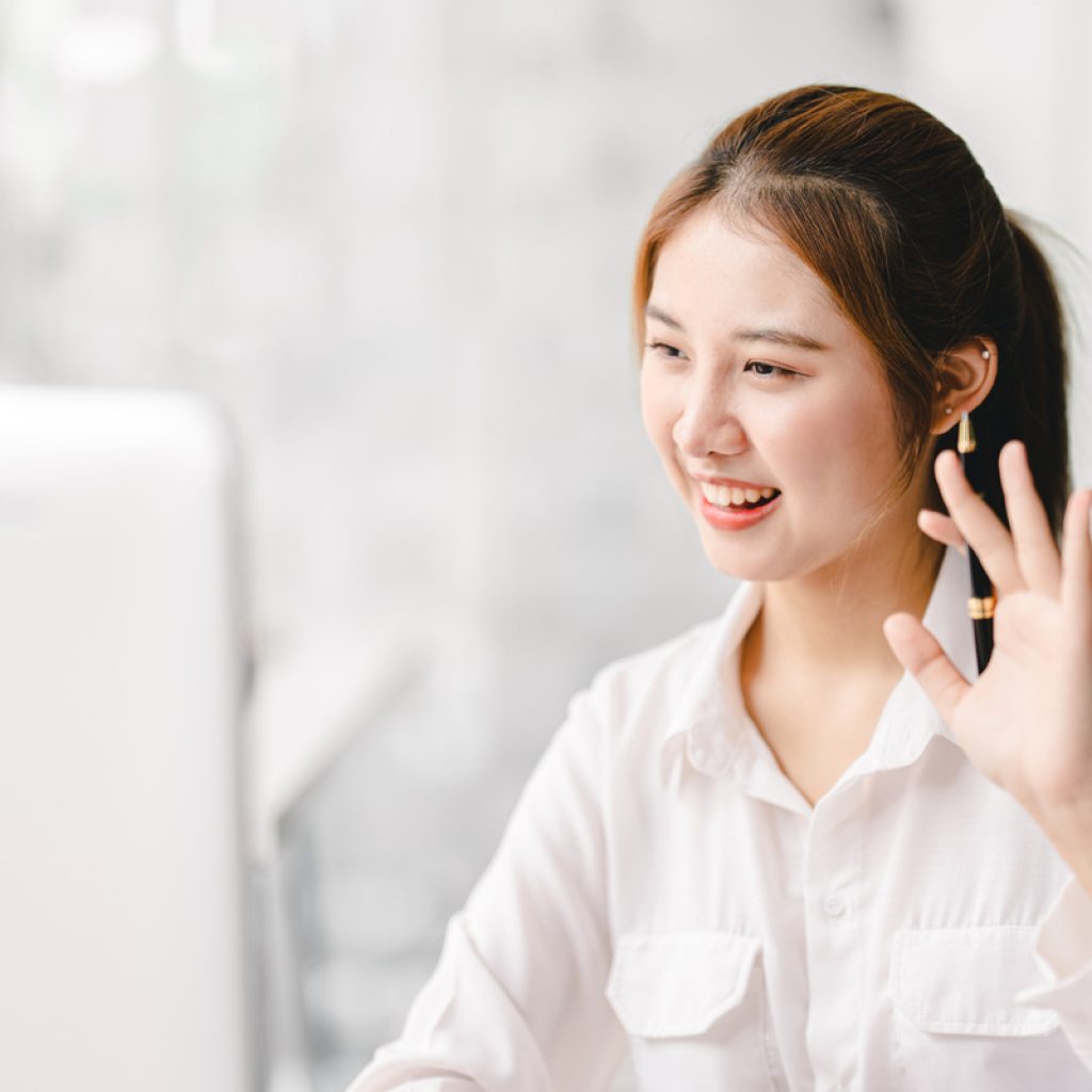 Portrait of an asian woman having a video conference